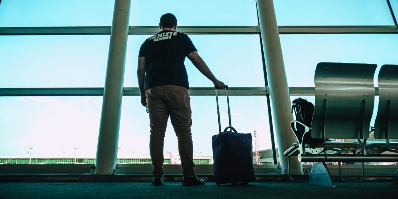 man holding luggage bag