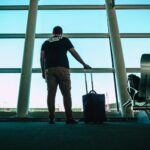 man holding luggage bag