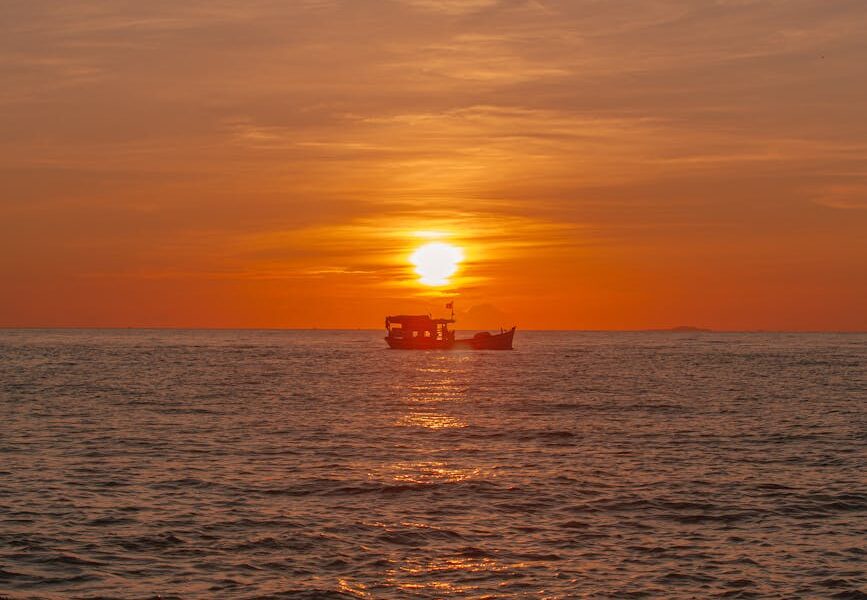 Severe Summer Storms Sweep Across Spain as Meteorologists Blame Mediterranean Heat stunning ocean sunset with silhouette boat