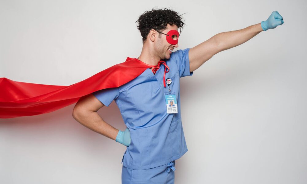 positive doctor in red superhero costume