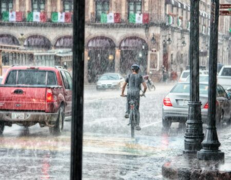 person riding a bicycle during rainy day