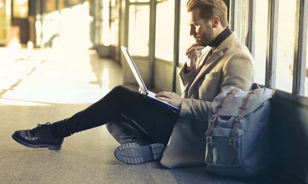 The Week Ahead Brings Protests and Political Downtime brown haired man using laptop computer