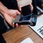 customer paying contactless with a smartphone