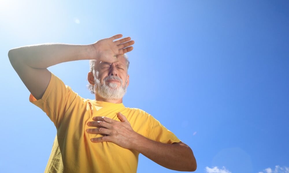 Weakness, Dizziness and Headaches: Key Warning Signs of High Temperatures Senior man suffering from heat stroke outdoors